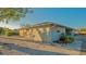 Charming single story building featuring the unit numbers, manicured landscaping, and a sunny exterior at 101 Base E Ave # 101 103, Venice, FL 34285