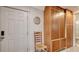 Hallway view with built-in cabinets, and a door leading to bathroom at 101 Base E Ave # 101 103, Venice, FL 34285