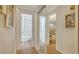 Hallway with a mirror showing a bathroom and bedroom at 101 Base E Ave # 101 103, Venice, FL 34285