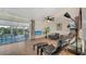 A spacious living room with tile floors, a ceiling fan, and lots of comfortable seating at 101 Base E Ave # 101 103, Venice, FL 34285