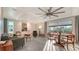 Open-concept living room with tile floors and abundant natural light at 101 Base E Ave # 101 103, Venice, FL 34285