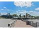 Attractive beachside restaurant and pier view, featuring outdoor seating and inviting architecture at 101 Base E Ave # 101 103, Venice, FL 34285