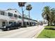 Bustling street view showcasing local shops and businesses on a sunny day at 101 Base E Ave # 101 103, Venice, FL 34285