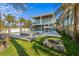 Spacious backyard with a pool, spa, and a fire pit perfect for relaxing or entertaining friends and Gathering at 108 Magnolia Ave, Anna Maria, FL 34216
