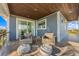 Balcony with outdoor seating and stylish poufs, perfect for enjoying the scenery at 108 Magnolia Ave, Anna Maria, FL 34216