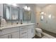 Elegant bathroom with double sinks, granite countertops and glass shower at 108 Magnolia Ave, Anna Maria, FL 34216
