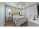 Cozy bedroom with soft colors, natural light, comfortable bed, and ample closet space at 108 Magnolia Ave, Anna Maria, FL 34216