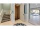 Interior featuring an elevator, stairs, and tile flooring with seamless access to other levels at 108 Magnolia Ave, Anna Maria, FL 34216