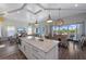 Bright kitchen featuring a large island, adjacent seating area and lots of natural light at 108 Magnolia Ave, Anna Maria, FL 34216