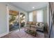 Comfortable living room features sliding doors leading to an outdoor porch at 108 Magnolia Ave, Anna Maria, FL 34216