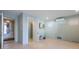Spacious living room with modern fixtures, stone floors, and ample natural light at 108 Magnolia Ave, Anna Maria, FL 34216