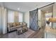 Cozy living room featuring a comfortable couch, stylish coffee table, and a decorative sliding barn door at 108 Magnolia Ave, Anna Maria, FL 34216