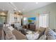 Comfortable living room with a couch, TV and wet bar at 108 Magnolia Ave, Anna Maria, FL 34216