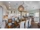 Spacious open-concept kitchen and living area with modern appliances, ample seating, and stylish decor at 108 Magnolia Ave, Anna Maria, FL 34216