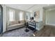 Inviting home office features a work space, a sofa and an area rug at 108 Magnolia Ave, Anna Maria, FL 34216