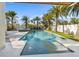 Beautiful backyard pool area with lounge chairs and palm trees, perfect for relaxation and entertaining at 108 Magnolia Ave, Anna Maria, FL 34216