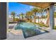 Backyard pool and spa area featuring lush landscaping and a serene atmosphere for outdoor relaxation at 108 Magnolia Ave, Anna Maria, FL 34216