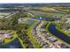 An aerial view of a well-planned community with multiple lakes and easy highway access for commuters at 11531 Moonsail Dr, Parrish, FL 34219