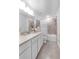 Bright bathroom features tiled shower/tub, neutral color palette, and modern vanity with sink at 11531 Moonsail Dr, Parrish, FL 34219