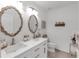 Bathroom featuring double sinks and framed mirrors at 11531 Moonsail Dr, Parrish, FL 34219