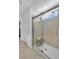 Modern bathroom features a glass shower with a built-in bench and ample natural light at 11531 Moonsail Dr, Parrish, FL 34219