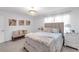 Bright bedroom features a cozy bed, soft lighting, and stylish décor at 11531 Moonsail Dr, Parrish, FL 34219