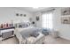Charming bedroom with nautical decor, decorative bedding, and ample natural light from the window at 11531 Moonsail Dr, Parrish, FL 34219
