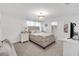 Comfortable bedroom features a neutral color palette, soft lighting, and ample closet space at 11531 Moonsail Dr, Parrish, FL 34219