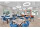 Clubhouse features tables with comfortable seating, recessed lighting, and a bright, welcoming atmosphere at 11531 Moonsail Dr, Parrish, FL 34219