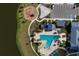 Overhead view of the community pool and playground area, a picturesque gathering place for residents at 11531 Moonsail Dr, Parrish, FL 34219