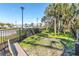 Community dog park is fenced and shaded to allow furry friends to exercise in a controlled environment at 11531 Moonsail Dr, Parrish, FL 34219