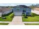 Beautiful two-story home with solar panels, a two car garage, and well manicured landscaping at 11531 Moonsail Dr, Parrish, FL 34219