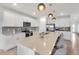 Bright kitchen features stainless steel appliances and a spacious island with seating at 11531 Moonsail Dr, Parrish, FL 34219