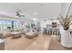 Bright, open-concept living room with modern furnishings and a view of the water at 11531 Moonsail Dr, Parrish, FL 34219