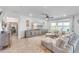 Bright living room with a comfortable gray sectional sofa and a serene view, perfect for relaxation at 11531 Moonsail Dr, Parrish, FL 34219