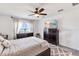 Bedroom featuring ceiling fan, lake views, and a patterned rug at 11531 Moonsail Dr, Parrish, FL 34219
