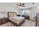 Bedroom featuring ceiling fan, lake views, and a patterned rug at 11531 Moonsail Dr, Parrish, FL 34219