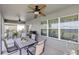 Cozy outdoor patio with ceiling fans, a dining table, and a grill, ideal for entertaining guests at 11531 Moonsail Dr, Parrish, FL 34219
