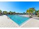 Resort-style community pool with plenty of lounge space and areas for playing at 11531 Moonsail Dr, Parrish, FL 34219