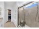Shower featuring glass door, tile walls, and a bench at 11531 Moonsail Dr, Parrish, FL 34219