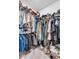 This walk-in closet is maximized with hanging racks and shelving for optimal storage of clothing and accessories at 11531 Moonsail Dr, Parrish, FL 34219