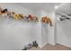 Organized walk-in closet featuring plush animal toys on shelves, maximizing storage space at 11531 Moonsail Dr, Parrish, FL 34219