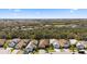 Aerial view featuring real estate nestled amongst lush greenery and lakes, showcasing community layout at 11981 Hunters Creek Rd, Venice, FL 34293