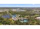 The aerial view captures the community amenities, which includes a clubhouse and a pool at 11981 Hunters Creek Rd, Venice, FL 34293