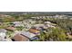 Community aerial view showcasing a home with a screened pool and lush surroundings at 11981 Hunters Creek Rd, Venice, FL 34293