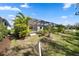 Grassy backyard featuring landscaping, a pool, and fencing at 11981 Hunters Creek Rd, Venice, FL 34293