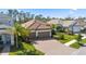 Attractive single Gathering home with a tile roof and a three-car garage at 11981 Hunters Creek Rd, Venice, FL 34293
