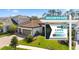 Charming two-story home featuring a well-manicured lawn and a sign promoting a discounted interest rate at 11981 Hunters Creek Rd, Venice, FL 34293