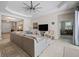 Bright living room with comfortable seating, tray ceilings, and open entryway at 11981 Hunters Creek Rd, Venice, FL 34293