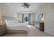 Comfortable main bedroom with neutral decor, tray ceiling, and plenty of natural light at 11981 Hunters Creek Rd, Venice, FL 34293